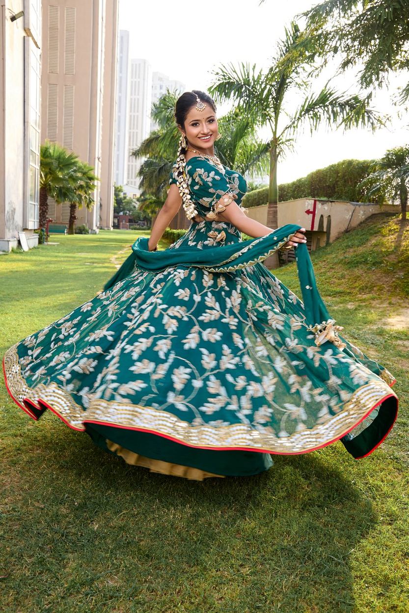 Emerald green festive lehenga in motion