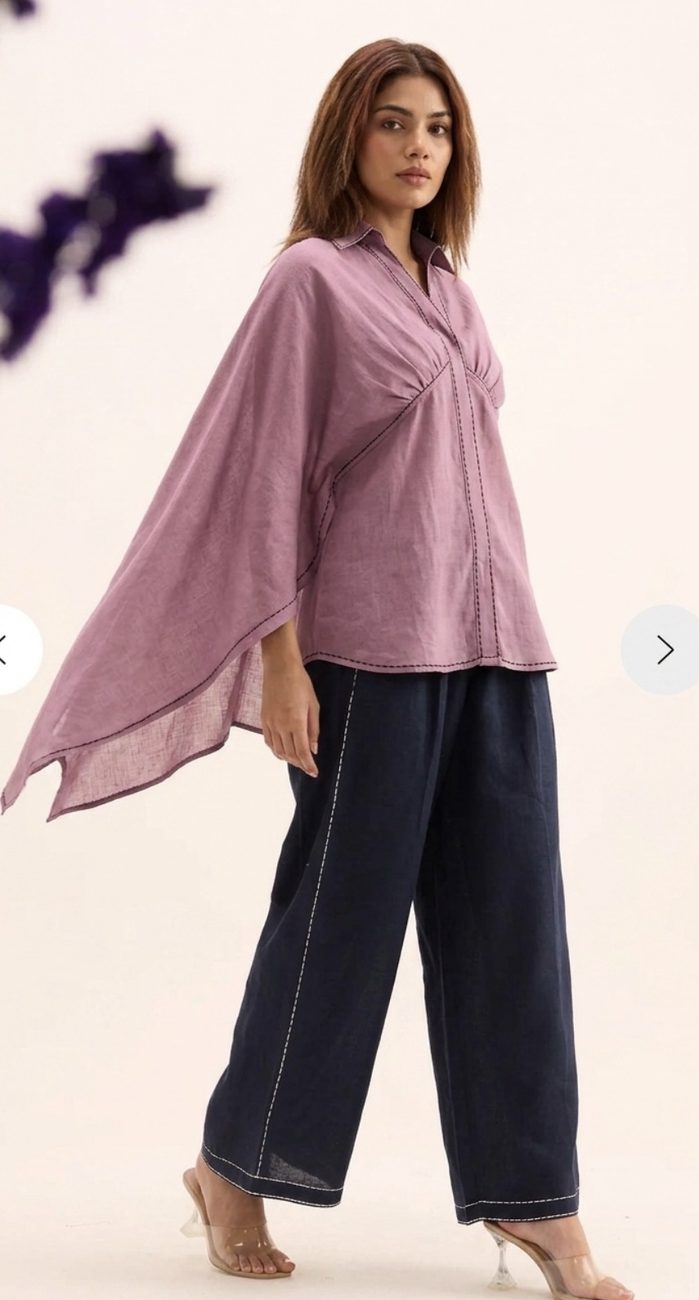 Mauve linen cape top with navy trousers